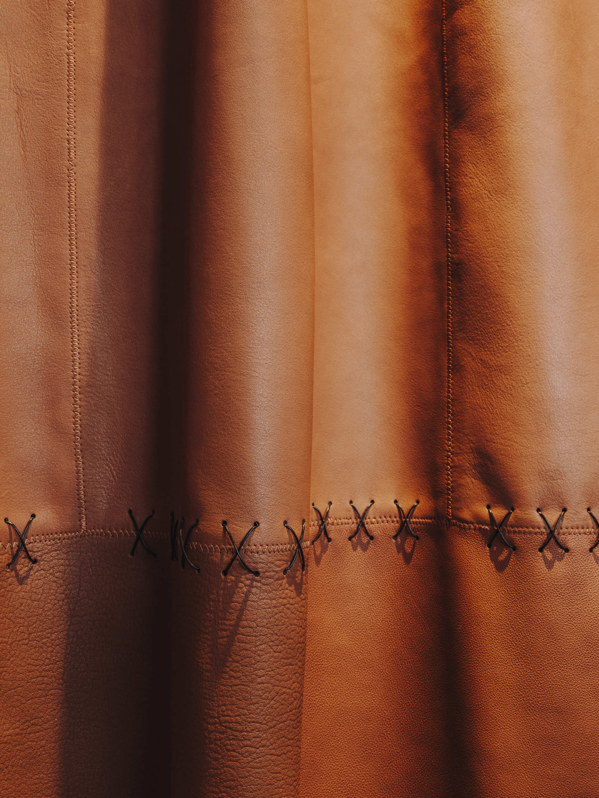 Sculptural leather curtain in headquarters interior design